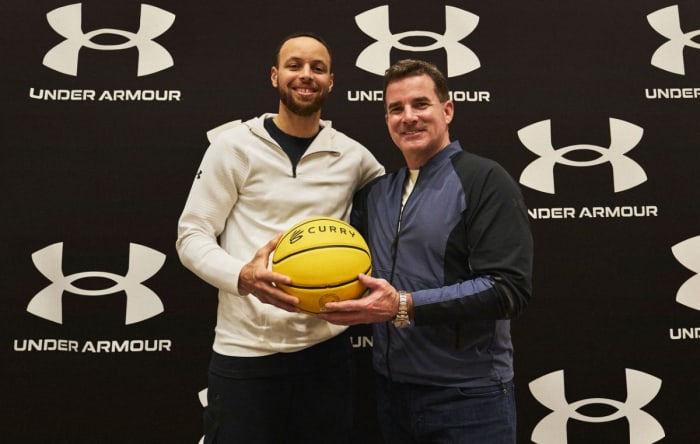 Stephen Curry poses for a photo with Kevin Plank.
